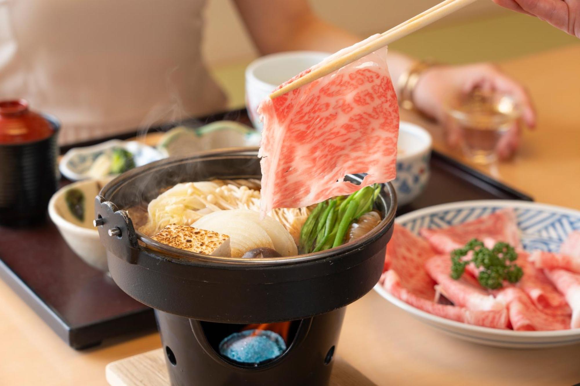 Hotel Associa Toyohashi Exteriör bild A piece of Kobe beef being cooked in a pot